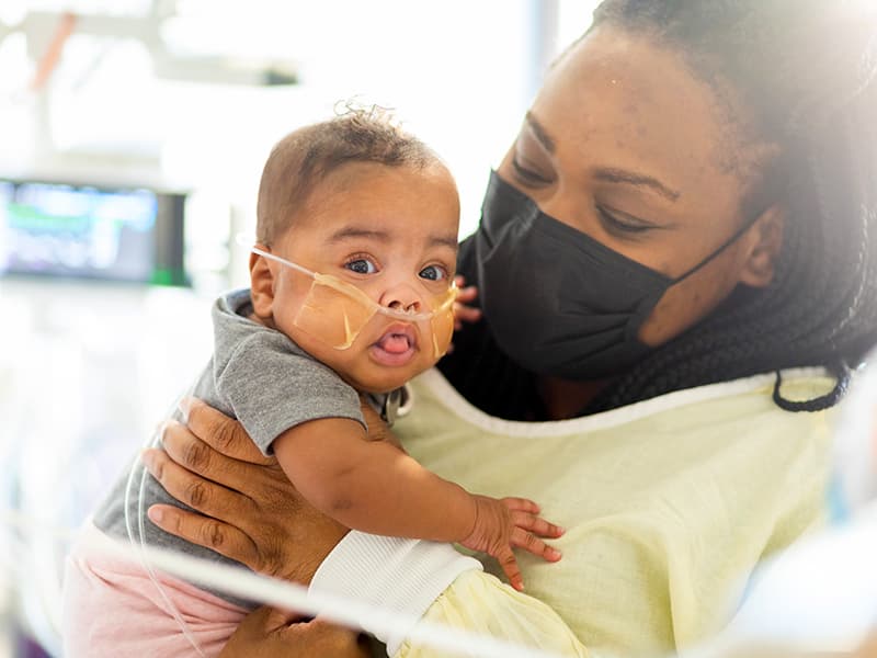 Jessica Carter of Jackson plays with daughter Lyndsey Lee Carter in one of the new private NICU rooms in the Kathy and Joe Sanderson Tower at Children's of Mississippi.